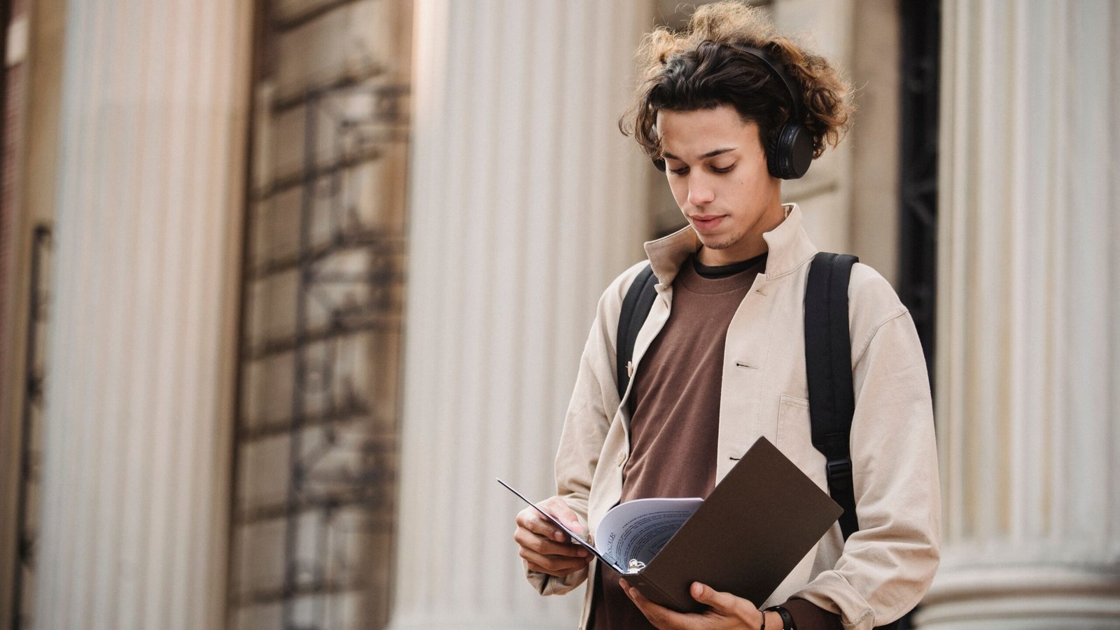 University student reviewing academic documents and student financing choices