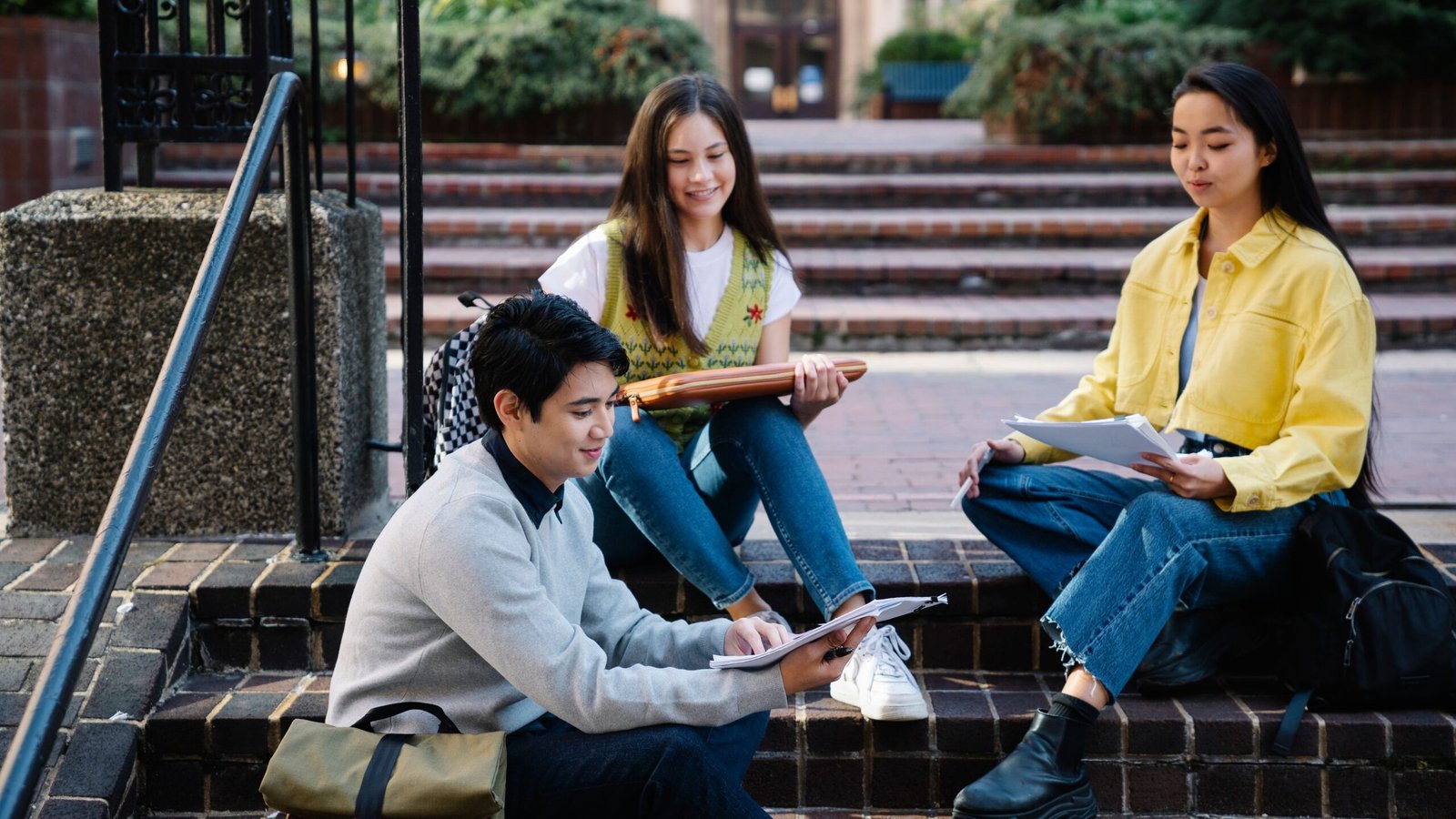 University students together on campus illustrating international college financing