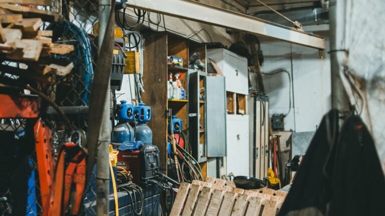 Tools, cables and equipment stored inside an industrial workshop.