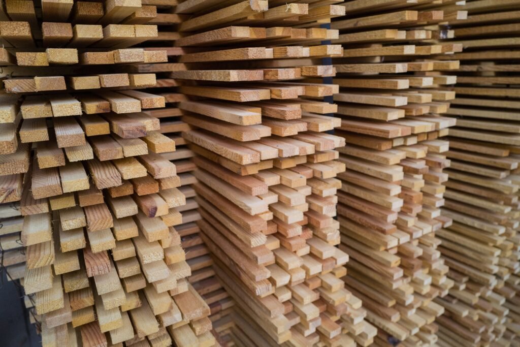 Rows of timber boards stacked with their cut ends facing forward.
