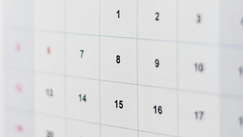 A close-up of the numbered grid on a paper desk calendar.