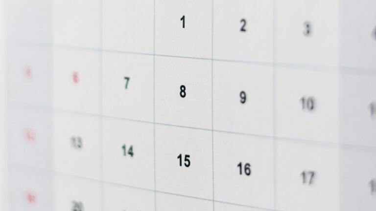 A close-up of the numbered grid on a paper desk calendar.