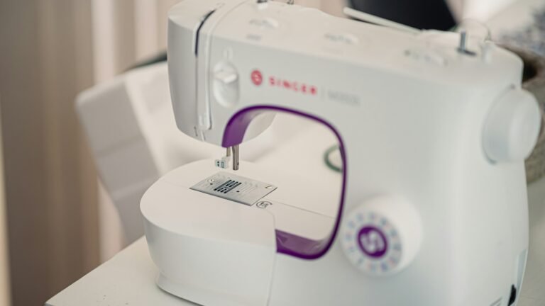White sewing machine on a table.